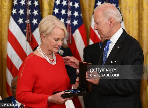 President Joe Biden presents Cindy McCain , the widow of former Senator and presidential candidate John McCain, posthumously with the Presidential...
