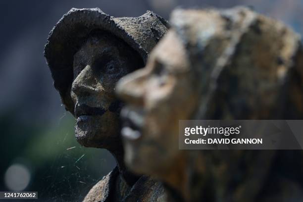 Irish sculptor Rowan Gillespie's Famine Memorial statues are pictured on the banks of the River Liffey in Dublin, Ireland on July 7, 2022. - The...