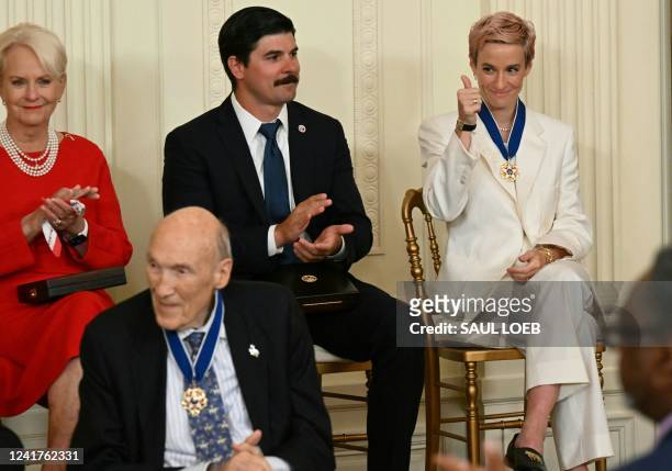 Soccer player Megan Rapinoe gives a thumbs up after receiving the Presidential Medal of Freedom, the nation's highest civilian honor, during a...