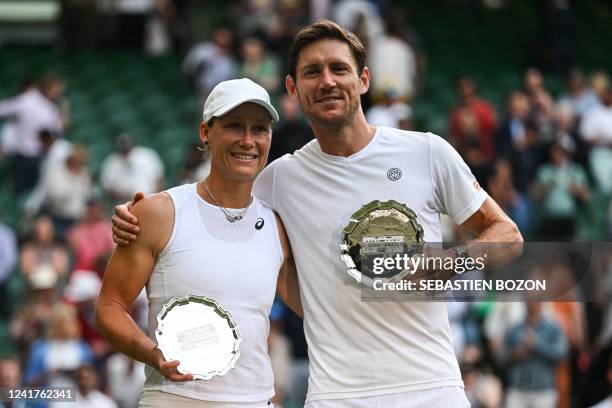 Australia's Matthew Ebden and Samantha Stosur pose with their runner-up trophies after being defeated by Britain's Neal Skupski and US player Desirae...