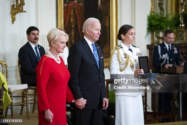 President Joe Biden posthumously presents the Presidential Medal of Freedom to Cindy McCain, left, in honor of Arizona Senator John McCain during a...