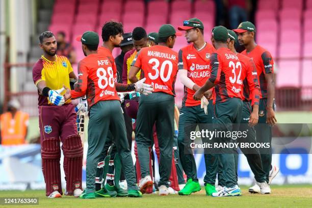 Bangladesh teammates congratulate Nicholas Pooran of West Indies for winning the third and final T20 International match between West Indies and...