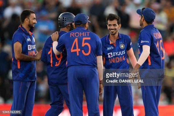 India's Yuzvendra Chahal celebrates with teammates after taking the wicket of England's Moeen Ali during the '1st Vitality IT20' Twenty20...