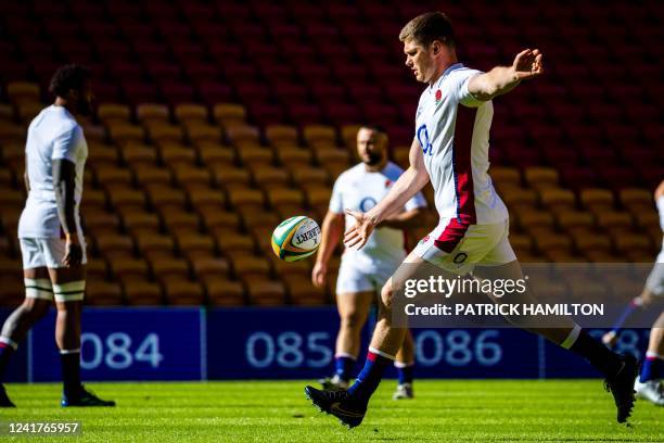 England's Owen Farrell kicks the ball during team captain's run at Suncorp Stadium in Brisbane on July 08 ahead of the second rugby union Test...