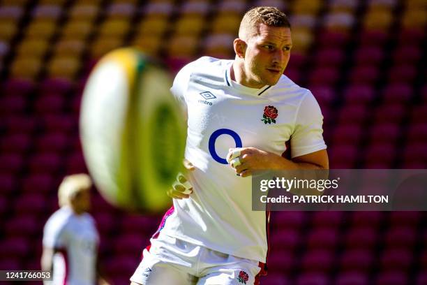 England's Sam Underhill warms up during team captain's run at Suncorp Stadium in Brisbane on July 08 ahead of the second rugby union Test between...