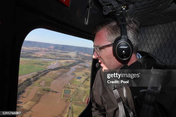 Premier Dominic Perrottet surveys flooding on a tour with Emergency Services and Resilience and Minister for Flood Recovery Steph Cooke on July 08,...