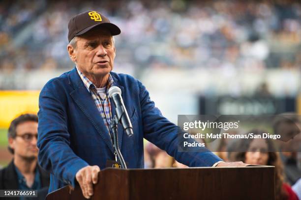 Former San Diego Padres president and CEO Larry Lucchino speaks during his induction ceremony in the San Diego Padres Hall of Fame before the game...