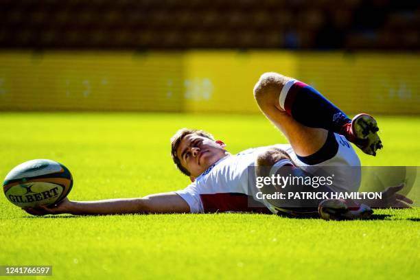 England's Jack van Poortvliet warms up during the captain's run at Suncorp Stadium in Brisbane on July 08 ahead of the second rugby union Test...