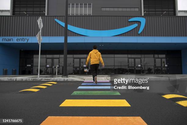 An employee enters the Amazon.com Inc. Fulfillment center in Sydney, Australia, on Tuesday, July 5, 2022. Amazon.com Inc. Became the third US tech...