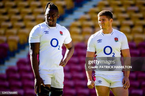 England players Owen Farrell and Maro Itoje look on during England's captain's run at Suncorp Stadium in Brisbane on July 08 ahead of the second...