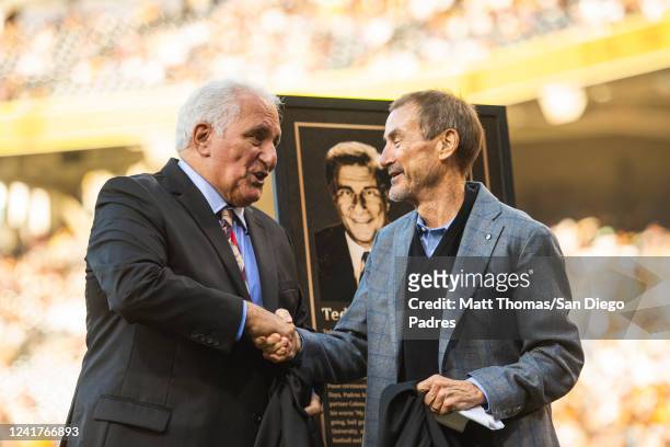 Former San Diego Padres broadcaster Ted Leitner shakes hands with Padres Chairman Peter Seidler during Leitners induction ceremony into the Padres...