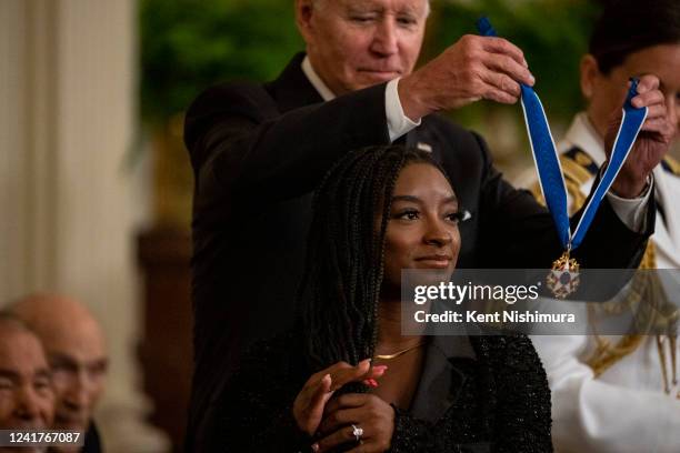 President Joe Biden presents the Presidential Medal of Freedom to Simone Biles, Olympic gold medal gymnast and mental health advocate, during a...