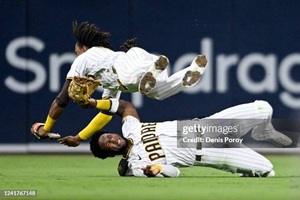 Abrams of the San Diego Padres collides with Jurickson Profar as he makes a catch on a ball hit by Tommy La Stella of the San Francisco Giants during...