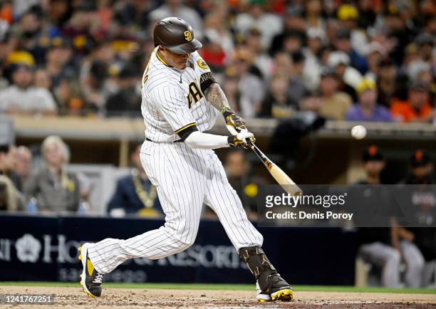 Manny Machado of the San Diego Padres hits a solo home run during the fourth inning of a baseball game against the San Francisco Giants July 7, 2022...