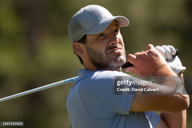 Former NFL quarterback and current CBS football analyst Tony Romo watches his drive on the 18th hole during the second practice round at the ACC Golf...