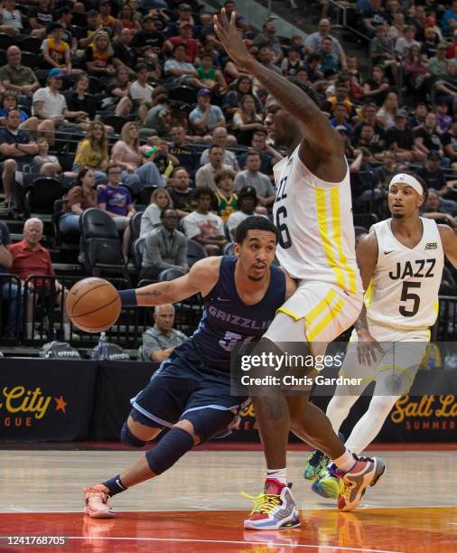 Tremont Waters of the Memphis Grizzlies drives into Kofi Cockburn of the Utah Jazz during the second half of their NBA Summer League game at the...