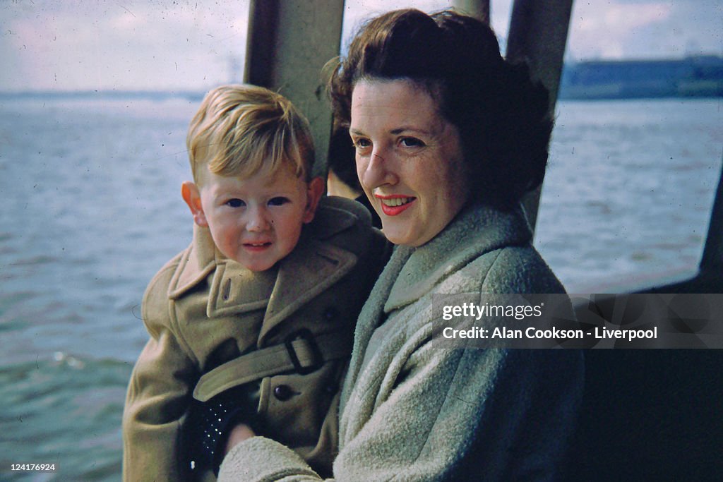 Woman with her son sitting in boat