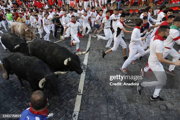 People take part in the traditional Running of the bulls during the San Fermin Festival in Pamplona, Navarra, Spain, 08 July 2022. Pamplona's Running...