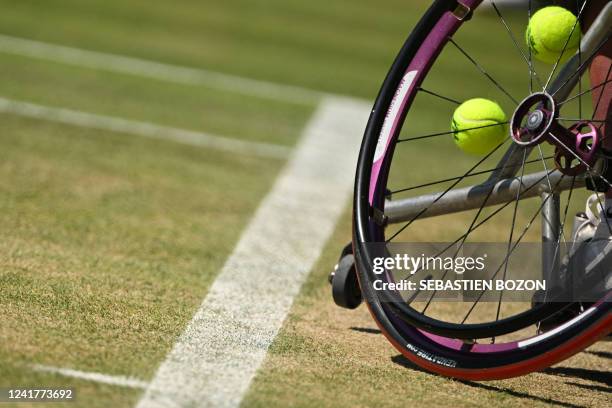 Netherlands' Jiske Griffioen holds her balls with her weelchair's spokes as she plays against Japan's Yuki Kamiji during their women's wheelchair...