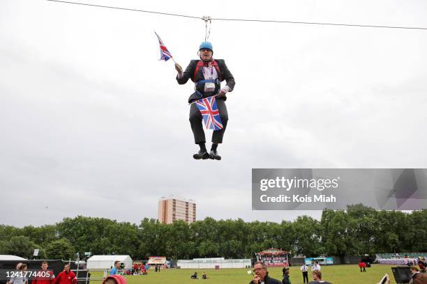 Mayor of London Boris Johnson gets stuck on a zip-line during BT London Live in Victoria Park on August 01, 2012 in London, England. Mr. Johnson was...