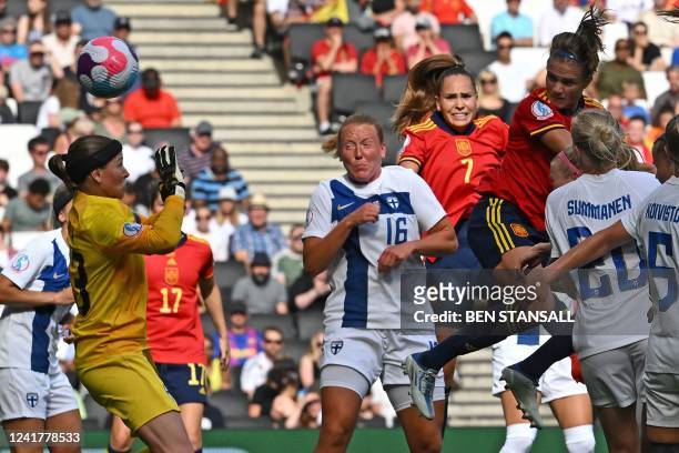 Spain's defender Irene Paredes jumps to head home their first goal during the UEFA Women's Euro 2022 Group B football match between Spain and Finland...