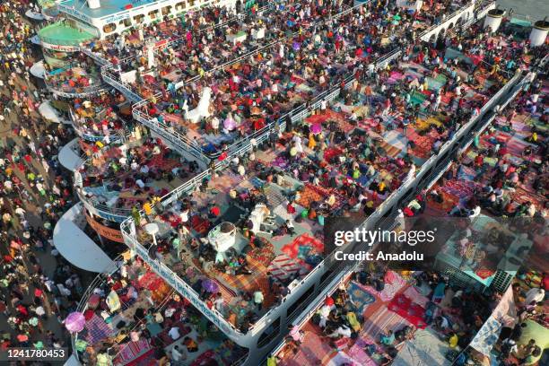 Aerial view of people board crowded ferries as they travel back home ahead of Eid al-Adha, the feast of the sacrifice in Dhaka, Bangladesh on July 8,...