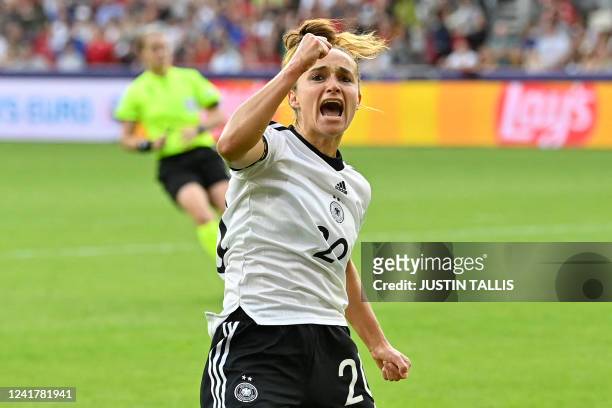 Germany's striker Lina Magull celebrates after scoring the opening goal of the UEFA Women's Euro 2022 Group B football match between Germany and...