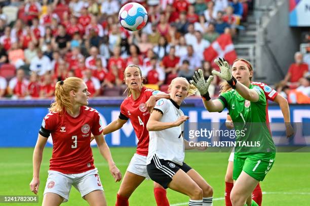 Denmark's goalkeeper Lene Christensen comes to catch the ball during the UEFA Women's Euro 2022 Group B football match between Germany and Denmark at...