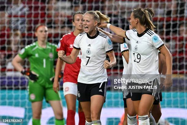 Germany's midfielder Lea Schuller celebrates with teammates after scoring their second goal during the UEFA Women's Euro 2022 Group B football match...