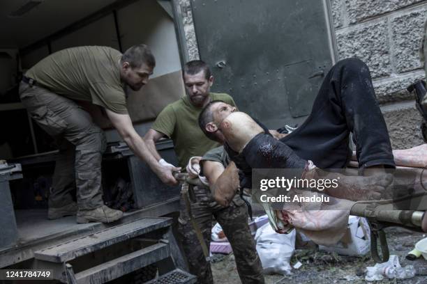 Local civilian is transferred to an ambulance after he was wounded during heavy shelling on a civilian area in Siversk, Ukraine, July 08th, 2022.