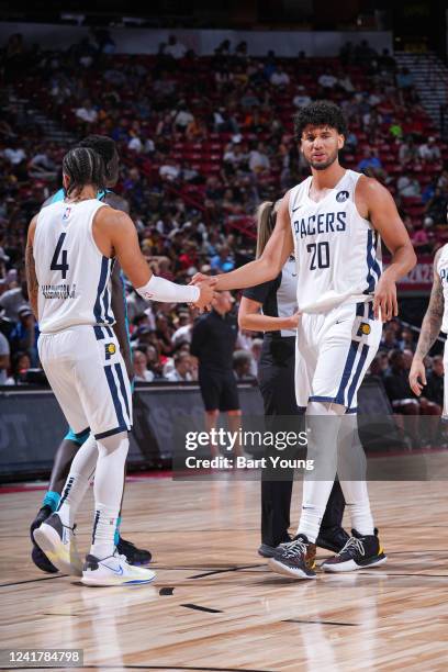 Duane Washington Jr. #4 and Bennie Boatwright of the Indiana Pacers high five against the Charlotte Hornets during the 2022 Las Vegas Summer League...