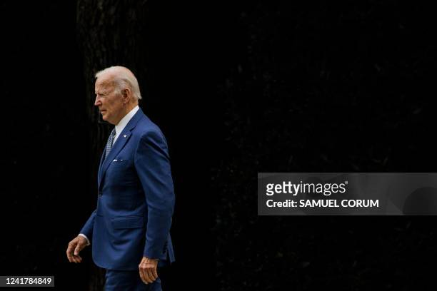 President Joe Biden walks to Marine One from the Oval Office at the White House in Washington, DC, on July 8, 2022. The President is traveling to his...