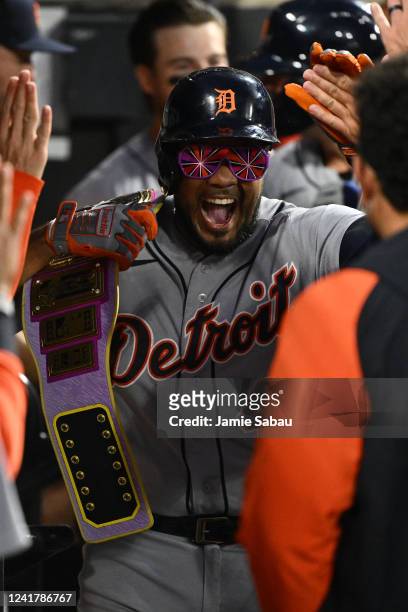 Jeimer Candelario of the Detroit Tigers celebrates his sixth inning two-run home run against the Chicago White Sox in the dugout at Guaranteed Rate...