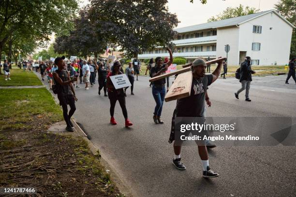 Demonstrators march in the street after holding a vigil in honor of Jayland Walker on July 8, 2022 in Akron, Ohio. Walker was shot by members of the...