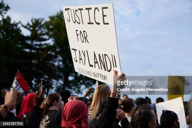 Demonstrator holds a sign during a vigil in honor of Jayland Walker on July 8, 2022 in Akron, Ohio. Walker was shot and killed by members of the...