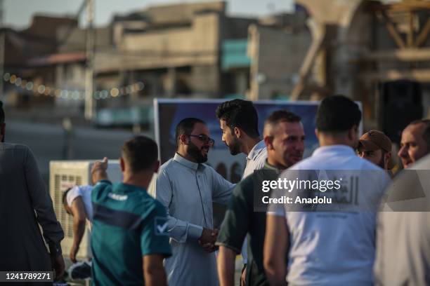 Muslims arrive to perform Eid al-Adha prayer among the ruins of the city's oldest mosque, The Great Mosque of al-Nuri which was detonated by Daesh in...