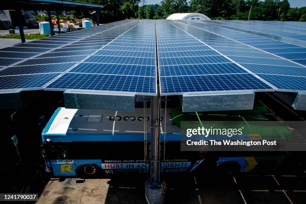 Solar panels make up the roof over parked busses as Montgomery County is just about to complete construction on its micro-grid enabled electric bus...