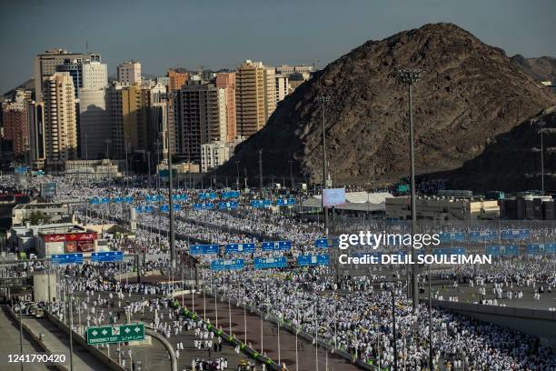 Thousands of Muslim pilgrims make their way across the valley of Mina, near Mecca in western Saudi Arabia, to perform the "stoning of the devil"...