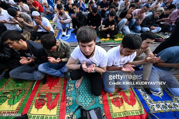Muslims pray on the first day of the Eid al-Adha in Moscow on July 9, 2022. - Muslims across the world celebrate the annual festival of Eid al-Adha,...