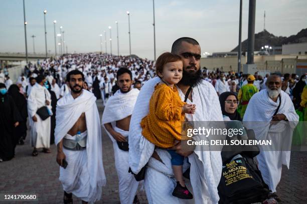 Thousands of Muslim pilgrims make their way across the valley of Mina, near Mecca in western Saudi Arabia, to perform the "stoning of the devil"...