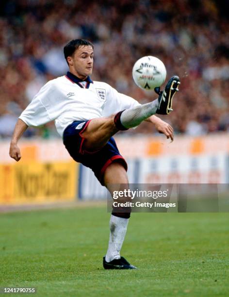 England player Dennis Wise controls the ball during an England match against Norway at Wembley Stadium on May 22, 1994 in London, United Kingdom.