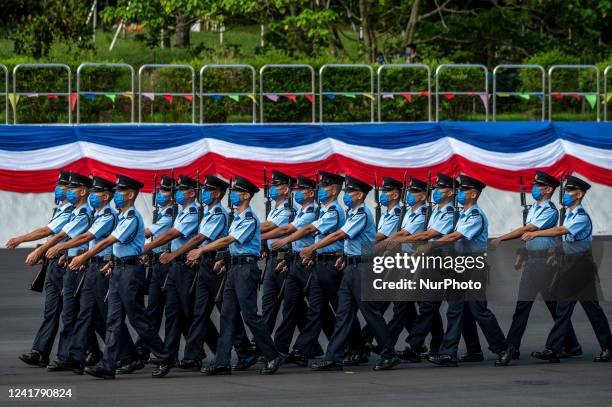 Police Officers marching on the parade ground during the passing-out parade inside the police collage on July 9, 2022 in Hong Kong, China.