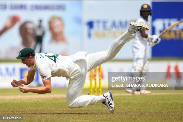 Australia's Cameron Green catches the ball to dismiss Sri Lanka's Pathum Nissanka during the second day of second cricket Test match between Sri...