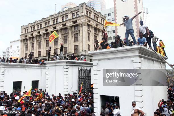 Protestors demanding the resignation of Sri Lanka's President Gotabaya Rajapaksa gather inside the compound of Sri Lanka's Presidential Palace in...