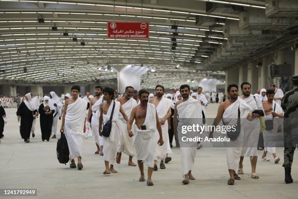 Muslim prospective pilgrims take part in the stoning of the devil at Jamrat al-Aqaba on the first day of Eid Al-Adha in Mecca, Saudi Arabia on July...