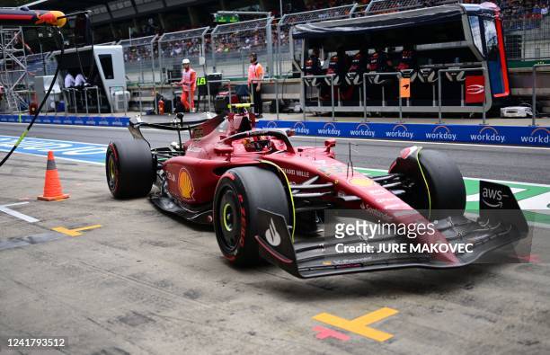 Ferrari's Spanish driver Carlos Sainz Jr leaves the pits during the second practice session at the Red Bull Ring race track in Spielberg, Austria, on...