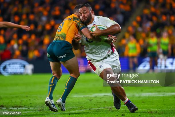 England's Billy Vunipola is tackled by Australia's Nic White during the International rugby union match between England and Australia at Suncorp...