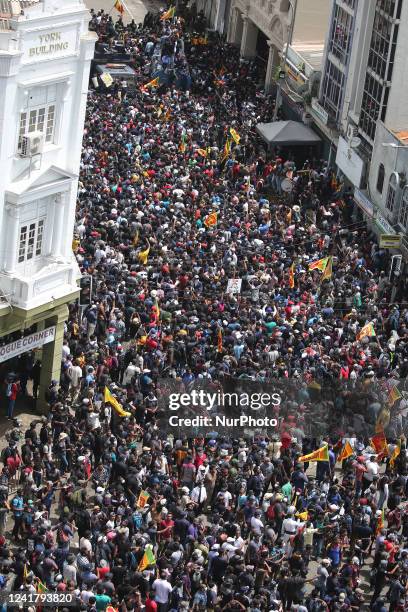 Protesters gather in a street leading to the presidents official residence, against Sri Lanka's President Gotabaya Rajapaksa while demanding his...