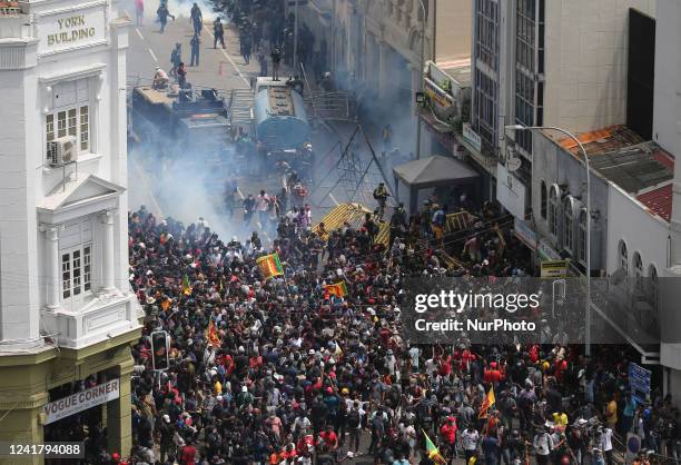 Police fired water and tear gas to disperse Protesters gathering in a street leading to the presidents official residence, against Sri Lanka's...