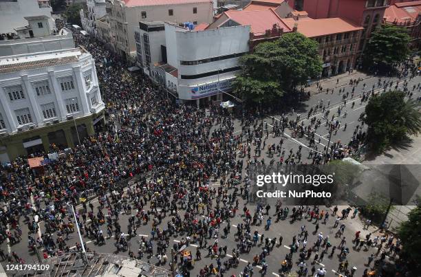 Protesters gather in a street leading to the presidents official residence, against Sri Lanka's President Gotabaya Rajapaksa while demanding his...